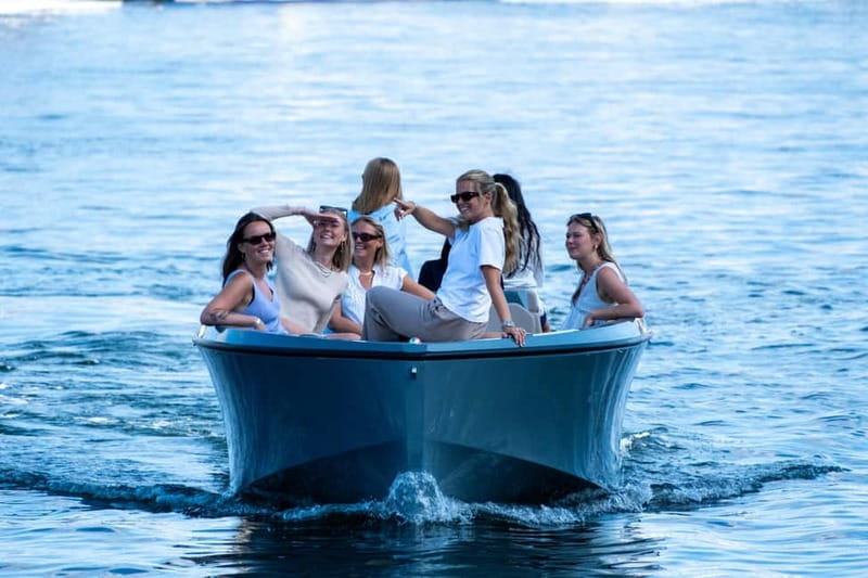 Copenhagen: 1 or 2-Hour Canal Tour in Silent Electric Boats - Staying Warm: Covered Boat, Heating Pads, Blankets