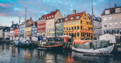 Copenhagen: Guided City Highlights Tour - Nyhavn’s canalside houses and the stories behind the view