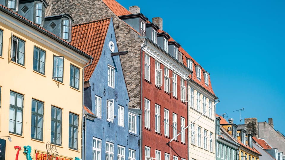 Copenhagen: Private Walking Tour - Nyhavn and the harbor pull: colorful townhouses and a long outdoor bar