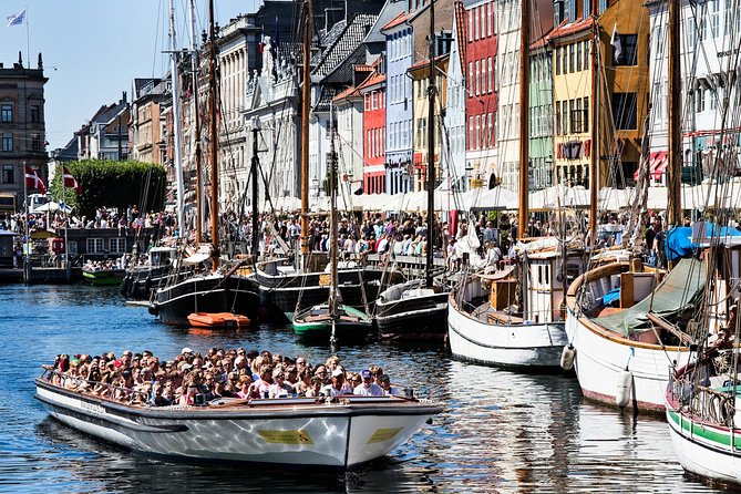 Copenhagen Sightseeing Classic Canal Tour With Live Guide - Christianshavn canals: cobblestones, pastel houses, and King Christian IV